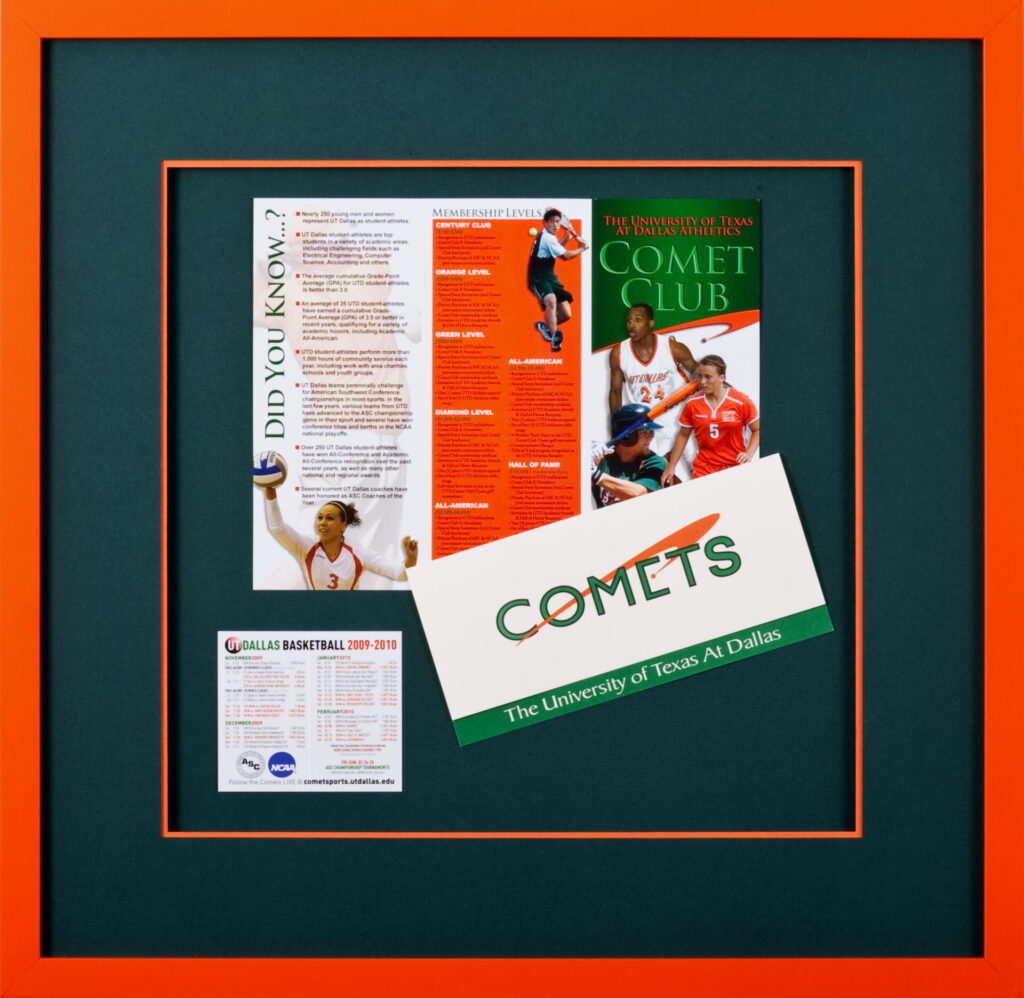 Framed University of Texas at Dallas Comets sports memorabilia collage with a dark green mat and custom orange frame.